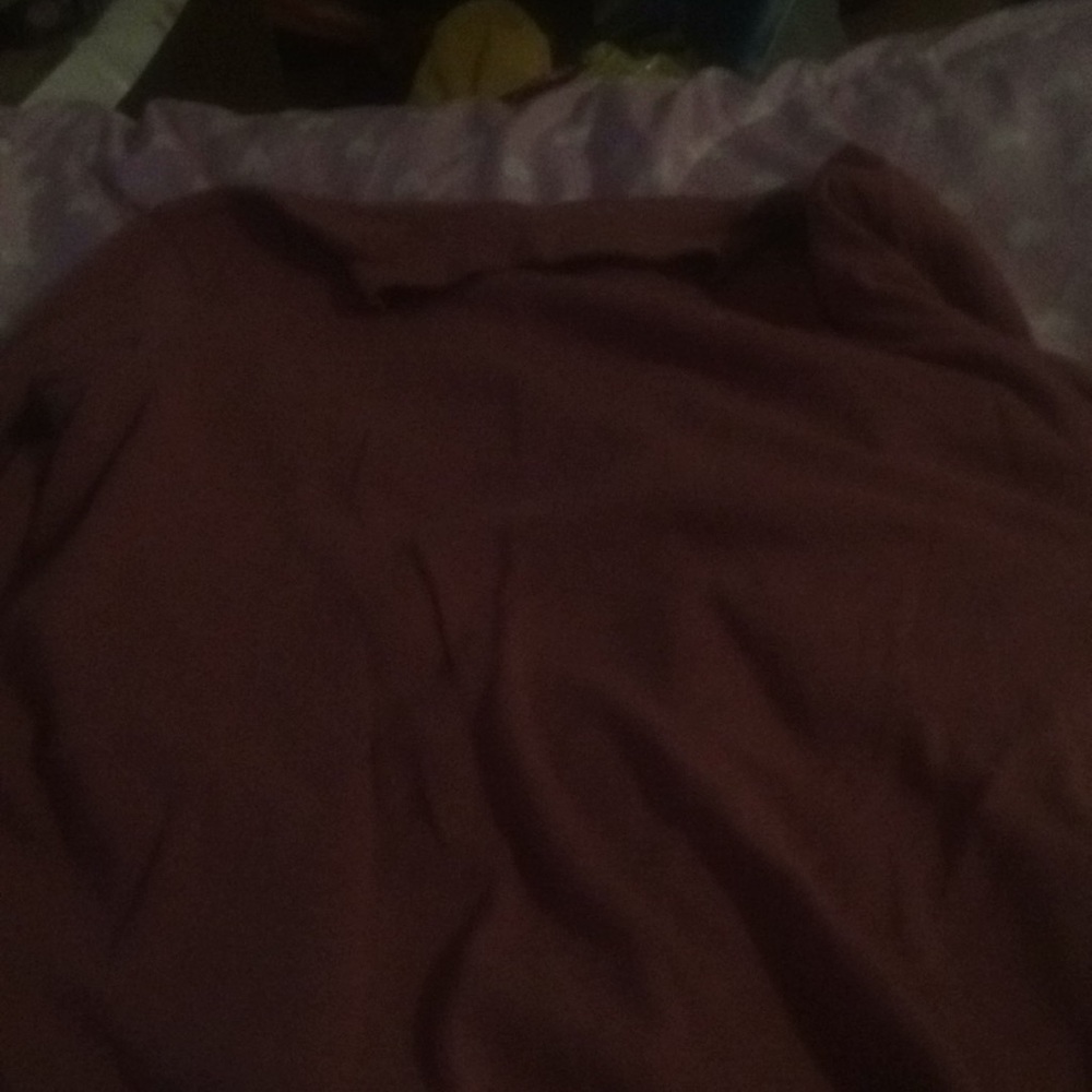 Pink turtleneck with long sleeves.